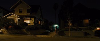 Movie still from “Fast & Furious” (2009), directed by Justin Lin – A person walking down a street at night; Extreme Wide shot, Low angle