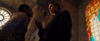 Movie still from “Fast & Furious” (2009), directed by Justin Lin – A man and a woman are standing in front of a pillar; Medium shot, Low angle