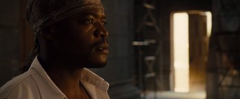 Movie still from “Fast & Furious” (2009), directed by Justin Lin – A person with a bandage on his head; Close Up shot, Low angle