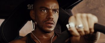 Movie still from “Fast & Furious” (2009), directed by Justin Lin – A person holding a cell phone; Close Up shot, High angle