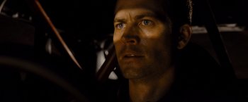 Movie still from “Fast & Furious” (2009), directed by Justin Lin – A man's face in the dark; Close Up shot, Over the shoulder angle