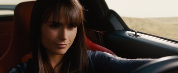 Movie still from “Fast & Furious” (2009), directed by Justin Lin – A beautiful young woman sitting in a car; Close Up shot, Over the shoulder angle