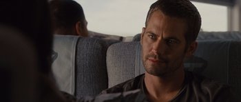 Movie still from “Fast Five” (2011), directed by Justin Lin – A person sitting on a seat; Close Up shot, Over the shoulder angle