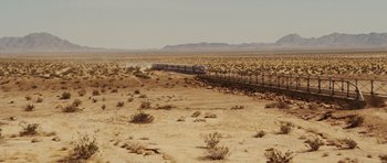 Movie still from “Fast Five” (2011), directed by Justin Lin – A train traveling through the desert on a sunny day; Extreme Wide shot, High angle
