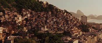 Movie still from “Fast Five” (2011), directed by Justin Lin – A view of a mountain with many buildings on it; Extreme Wide shot, High angle