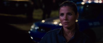 Movie still from “Fast Five” (2011), directed by Justin Lin – A woman is standing in front of a blue car; Close Up shot, Over the shoulder angle
