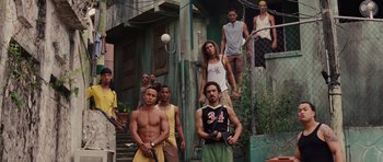 Movie still from “Fast Five” (2011), directed by Justin Lin – A group of men standing next to each other on a building; Wide shot, Low angle