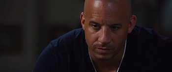 Movie still from “Fast Five” (2011), directed by Justin Lin – A man with a beard is looking at the camera; Close Up shot, Over the shoulder angle