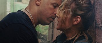 Movie still from “Fast Five” (2011), directed by Justin Lin – A man and a woman kissing in a forest; Close Up shot, Over the shoulder angle
