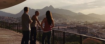 Movie still from “Fast Five” (2011), directed by Justin Lin – A man and a woman standing on a balcony overlooking a city; Wide shot, Over the shoulder angle