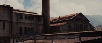 Movie still from “Fast Five” (2011), directed by Justin Lin – An old brick building with a tall brick chimney; Extreme Wide shot, Low angle
