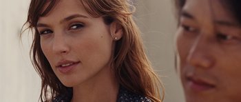 Movie still from “Fast Five” (2011), directed by Justin Lin – A woman's face with long brown hair; Close Up shot, Over the shoulder angle