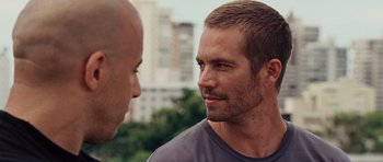 Movie still from “Fast Five” (2011), directed by Justin Lin – Two men are talking to each other outside; Close Up shot, Over the shoulder angle