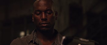 Movie still from “Fast Five” (2011), directed by Justin Lin – A person with his eyes closed; Close Up shot, Low angle