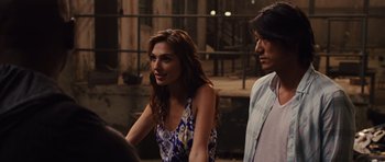 Movie still from “Fast Five” (2011), directed by Justin Lin – A woman and a man standing next to each other on the street; Close Up shot, Over the shoulder angle