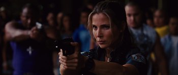 Movie still from “Fast Five” (2011), directed by Justin Lin – A woman is holding a gun in her hand; Close Up shot, Low angle
