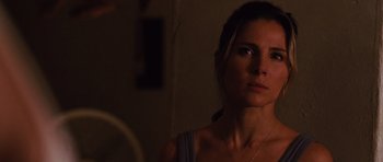 Movie still from “Fast Five” (2011), directed by Justin Lin – A beautiful woman looking at the camera in the dark; Close Up shot, Over the shoulder angle