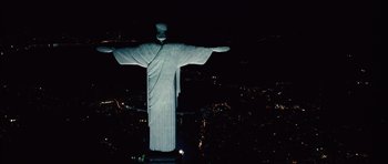 Movie still from “Fast Five” (2011), directed by Justin Lin – A statue of christ the redeemer in rio de janeiro at night; Extreme Wide shot, Low angle