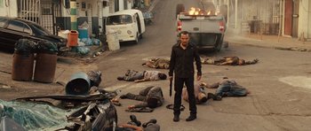 Movie still from “Fast Five” (2011), directed by Justin Lin – A group of dead bodies laying on the street; Wide shot, High angle