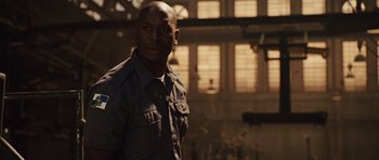 Movie still from “Fast Five” (2011), directed by Justin Lin – A man standing in front of a window in a room; Close Up shot, Low angle