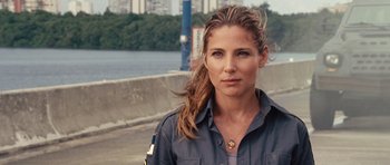 Movie still from “Fast Five” (2011), directed by Justin Lin – A woman with long brown hair wearing a blue shirt; Close Up shot, Over the shoulder angle