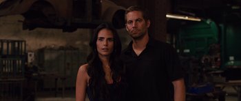 Movie still from “Fast Five” (2011), directed by Justin Lin – A man and a woman standing next to each other; Close Up shot, Over the shoulder angle