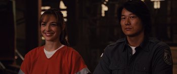 Movie still from “Fast Five” (2011), directed by Justin Lin – Two people standing next to each other in a dark room; Close Up shot, Over the shoulder angle