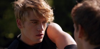 Movie still from “Fate: The Winx Saga” (2021), created by Brian Young – A person with long blonde hair; Close Up shot, Over the shoulder angle