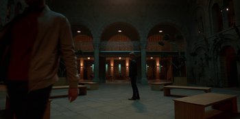 Movie still from “Fate: The Winx Saga” (2021), created by Brian Young – Two people are standing in an empty building; Extreme Wide shot, Low angle