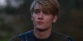 Movie still from “Fate: The Winx Saga” (2021), created by Brian Young – A person wearing a sweater; Close Up shot, Over the shoulder angle