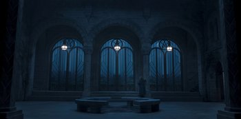 Movie still from “Fate: The Winx Saga” (2021), created by Brian Young – A person standing in front of a window at night; Extreme Wide shot, High angle