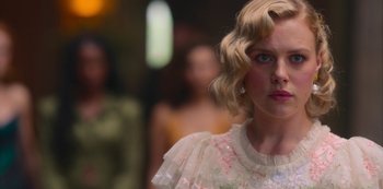 Movie still from “Fate: The Winx Saga” (2021), created by Brian Young – A person wearing a dress; Close Up shot, Over the shoulder angle