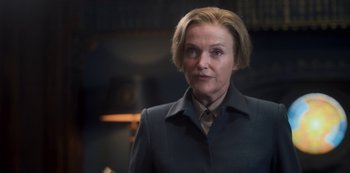 Movie still from “Fate: The Winx Saga” (2021), created by Brian Young – A woman with short blonde hair wearing a jacket; Close Up shot, Low angle