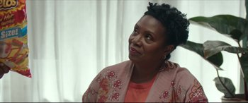 Movie still from “Fatherhood” (2021), directed by Paul Weitz – A person looking up at something; Close Up shot, Over the shoulder angle