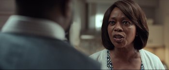 Movie still from “Fatherhood” (2021), directed by Paul Weitz – A woman in a white shirt is talking to a man in a suit; Close Up shot, Over the shoulder angle