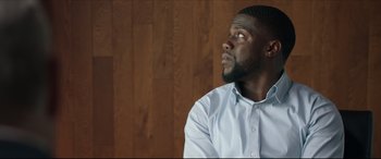 Movie still from “Fatherhood” (2021), directed by Paul Weitz – A person wearing a dress shirt; Close Up shot, Low angle