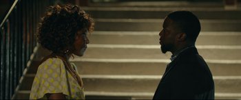 Movie still from “Fatherhood” (2021), directed by Paul Weitz – A man and a woman standing next to each other on some steps; Close Up shot, Over the shoulder angle