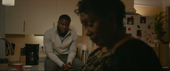 Movie still from “Fatherhood” (2021), directed by Paul Weitz – A man and a woman sitting in a room; Medium shot, Over the shoulder angle