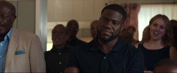 Movie still from “Fatherhood” (2021), directed by Paul Weitz – A group of men standing next to each other in a room; Close Up shot, Over the shoulder angle