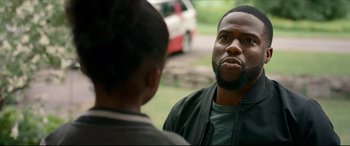 Movie still from “Fatherhood” (2021), directed by Paul Weitz – A man and a woman talking to each other outside; Close Up shot, Over the shoulder angle