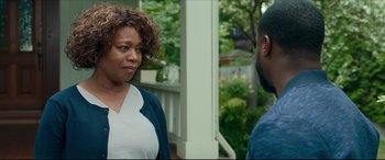 Movie still from “Fatherhood” (2021), directed by Paul Weitz – A woman and a man standing next to each other on a porch; Close Up shot, Over the shoulder angle