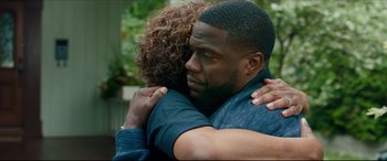 Movie still from “Fatherhood” (2021), directed by Paul Weitz – A man and a woman hugging each other; Close Up shot, Over the shoulder angle