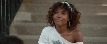 Movie still from “Fatherhood” (2021), directed by Paul Weitz – A beautiful young woman with curly brown hair; Close Up shot, Over the shoulder angle