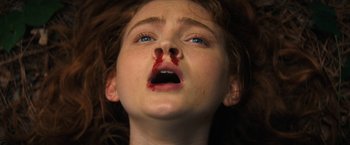 Movie still from “Fear Street: Part Two - 1978” (2021), directed by Leigh Janiak – A young girl with blood on her face and mouth; Extreme Close Up shot, Overhead angle