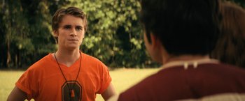 Movie still from “Fear Street: Part Two - 1978” (2021), directed by Leigh Janiak – Two young men are talking in a field; Close Up shot, Over the shoulder angle