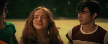 Movie still from “Fear Street: Part Two - 1978” (2021), directed by Leigh Janiak – A woman with long red hair sitting next to a man; Close Up shot, Low angle