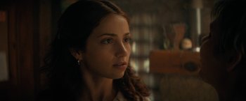 Movie still from “Fear Street: Part Two - 1978” (2021), directed by Leigh Janiak – A person wearing a white shirt; Close Up shot, Over the shoulder angle