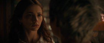 Movie still from “Fear Street: Part Two - 1978” (2021), directed by Leigh Janiak – A woman looking at her reflection in a mirror; Close Up shot, Over the shoulder angle