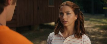 Movie still from “Fear Street: Part Two - 1978” (2021), directed by Leigh Janiak – A person wearing a striped shirt; Close Up shot, Over the shoulder angle