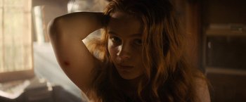 Movie still from “Fear Street: Part Two - 1978” (2021), directed by Leigh Janiak – A person with long hair; Close Up shot, Low angle